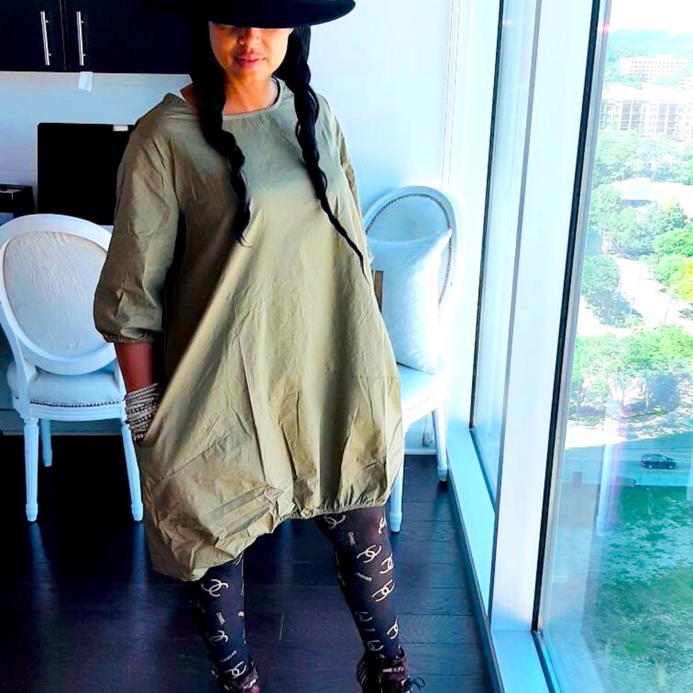 Loose asymmetrical dress. Dress size is for L/XL. Fits very loose.